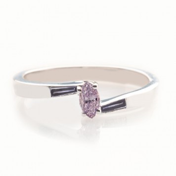 Lavender purple diamond set in a modern white gold ring, with two small 0.13 ct violet gray step-cut baguettes