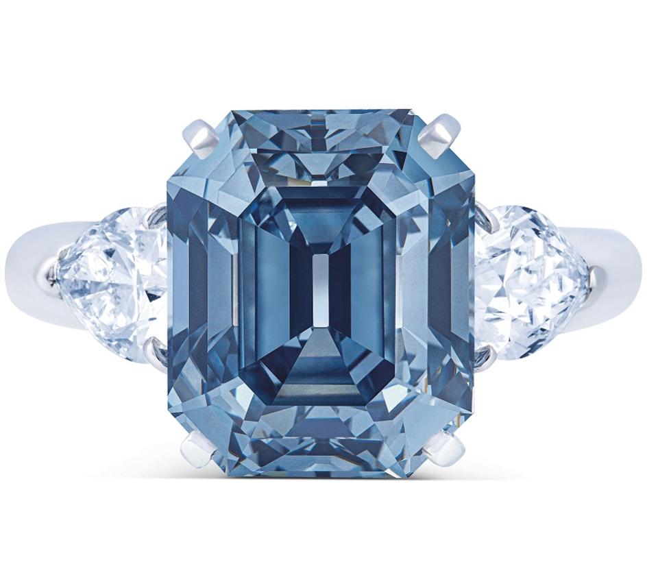 A diamond ring designed by Moussaieff set with a 7.03 carats, VVS2, fancy deep blue rectangular-cut diamond fetched $11.6 million. ydcdl Credit Christie's