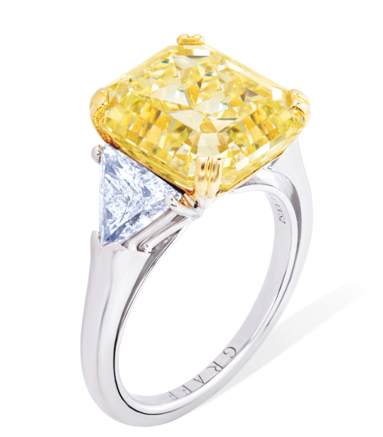 A  8.96 carat fancy intense yellow cut-cornered rectangular step-cut diamond 